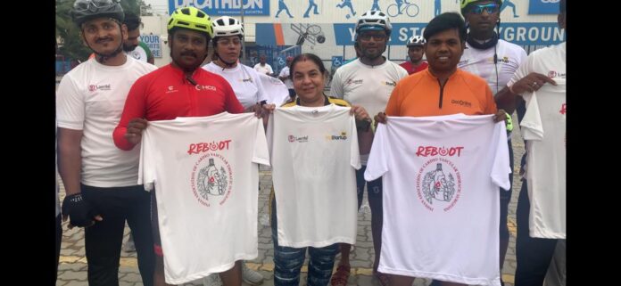 HCG founder 2nd from left dr Anita bhalla in Center with cyclist on reboot your heart cycling event on world heart day in hyderabad